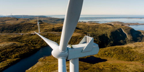 Wind turbine in coastal landscape