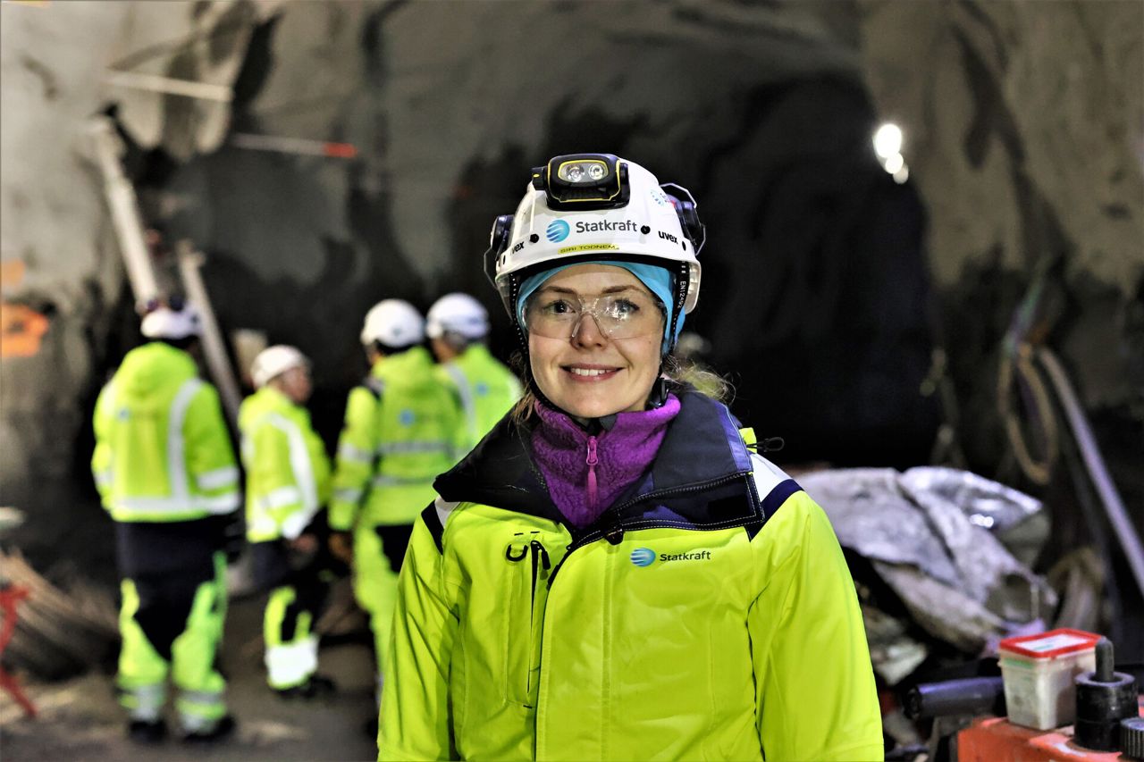 Woman smiling wearing safety gear